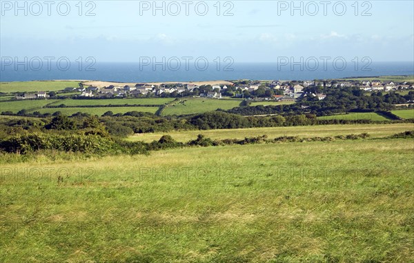 Linear coastal village of Trefin, viewed over fields, Pembrokeshire, Wales, United Kingdom, Europe