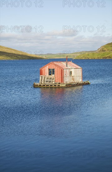 Fisherman's shed on small island, Olna Firth, Voe, Shetland Islands, Scotland, United Kingdom, Europe