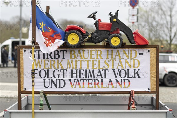 A demonstration sign mounted on a car trailer taken as part of the 'AeoeFarmers' protests'Aeo in Berlin, 22/03/2024