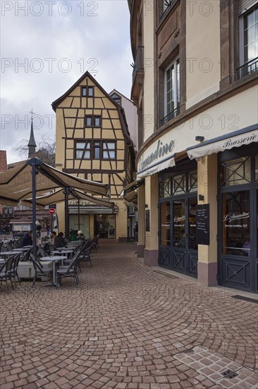 Old town with cobblestones, half-timbered houses and restaurants in Colmar, Haut-Rhin, Grand Est, France, Europe