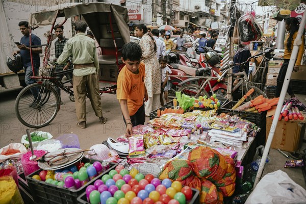 Vendor sells Holi celebration items in a street market, ahead of Holi festival on March 23, 2024 in Guwahati, Assam, India. Holi is the Hindu festival of colours, it is celebrated with great joy in India