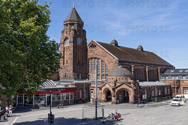 Historic Wilhelmine railway station, clock tower, pavilion with entrance to the station building, neo-Romanesque and Art Nouveau, red sandstone, cultural monument, listed building, Giessen, Giessen, Hesse, Germany, Europe