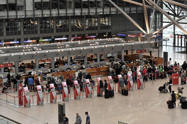 Check-in area of an airport with travellers and luggage, Hamburg, Hanseatic City of Hamburg, Germany, Europe