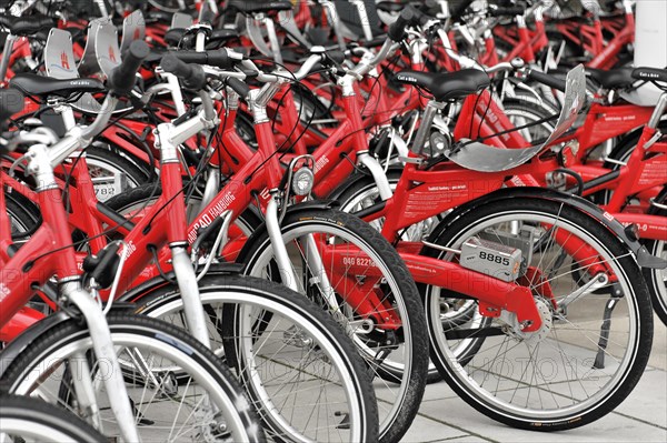 Close-up of red rental bicycles neatly arranged in rows, Hamburg, Hanseatic City of Hamburg, Germany, Europe