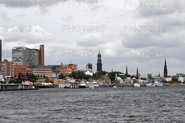 View of a city from the water with church towers and modern buildings, Hamburg, Hanseatic City of Hamburg, Germany, Europe