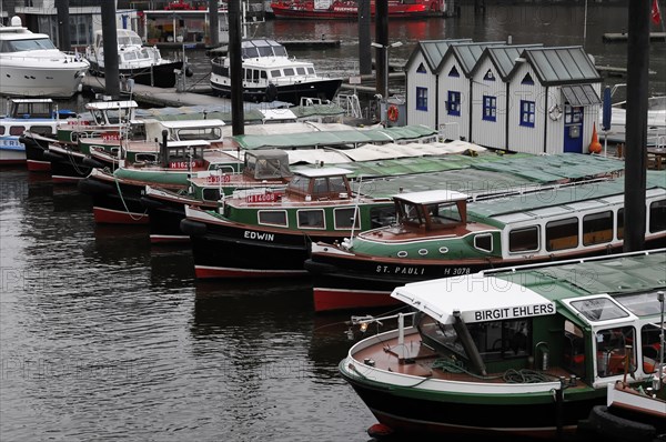 Row of launches and small boats moored at a dock in the harbour, Hamburg, Hanseatic City of Hamburg, Germany, Europe