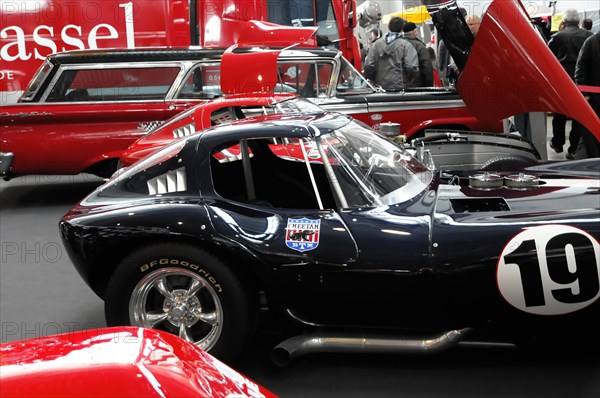 RETRO CLASSICS 2010, Stuttgart Messe, A black Cobra racing car with the number 19 exhibited alongside other racing cars, Stuttgart Messe, Stuttgart, Baden-Wuerttemberg, Germany, Europe