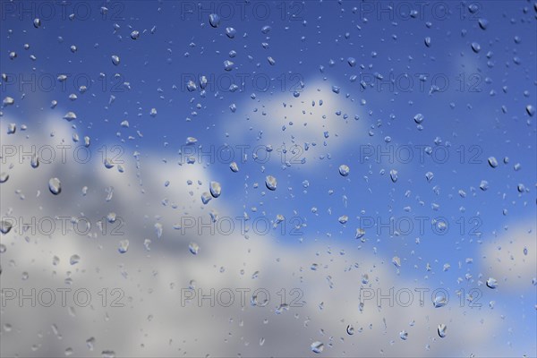 Raindrops on a window pane, North Rhine-Westphalia, Germany, Europe