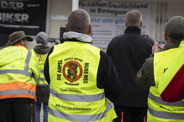 Demonstrators with printed high-visibility waistcoats, taken as part of the 'AeoeFarmers' protests'Aeo in Berlin, 22/03/2024