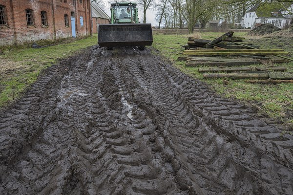 Tractor tyre tracks in softened soil on a farm, Mecklenburg-Vorpommern, Germany, Europe