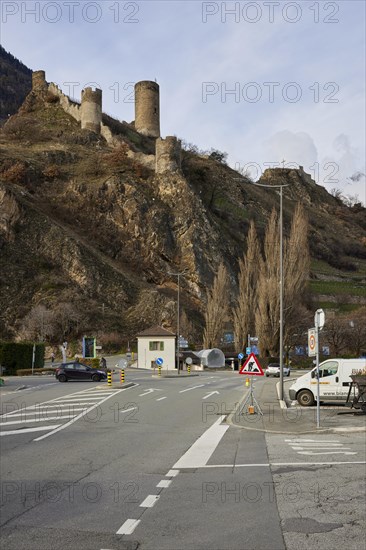 Saillon Castle with the Bayart tower and road in Saillon, district of Martigny, canton of Valais, Switzerland, Europe