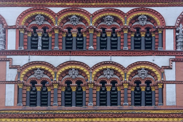 Detail with window, columns and grimaces from the tower of the Romanesque church of St Matthias, ornaments, figures, Benedictine Abbey, Trier, Rhineland-Palatinate, Germany, Europe