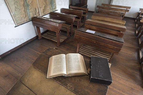 Classroom with Bible on the teacher's desk and school desks from the 19th century, Open-Air Museum of Folklore Schwerin-Muess, Mecklenburg-Vorpommerm, Germany, Europe
