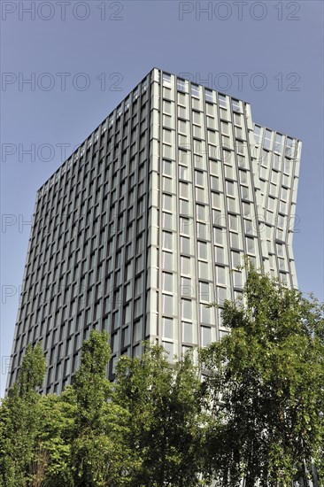 TANZENDE TUeRME, hotel and office building, completed in 2012, high-rise building with reflective glass facade next to trees under a clear blue sky, Hamburg, Hanseatic City of Hamburg, Germany, Europe