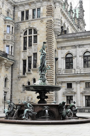 Opulent fountain with sculptures in front of historic architecture in a city centre, Hamburg, Hanseatic City of Hamburg, Germany, Europe