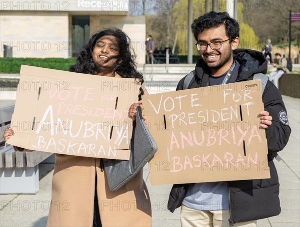 Two students holding election posters, University of Essex, Colchester, Essex, England, UK