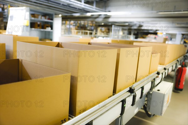 Cartons for dispatch on a conveyor belt in a logistics centre, Cologne, North Rhine-Westphalia, Germany, Europe