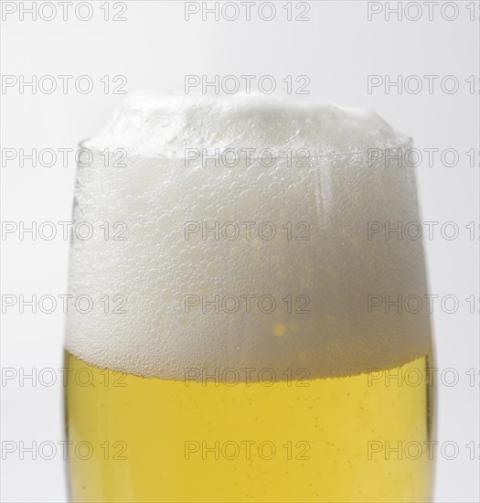 Freshly tapped beer with a head of foam in the beer glass, 07.12.2016