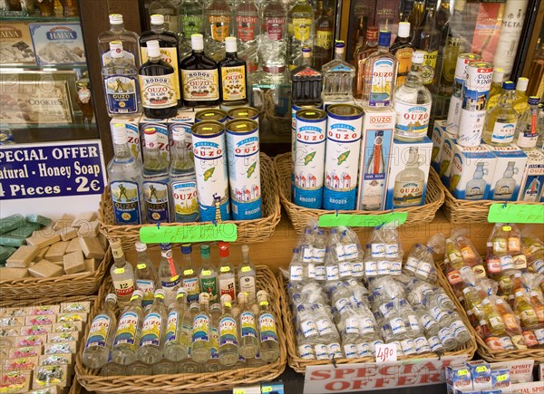 Shop display bottles of ouzo, Rhodes, Greece, Europe