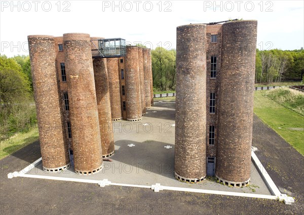An aerial photo shows 24 brick towers rising 22 metres into the sky above Lauchhammer. They are the only remaining part of a coking plant, the Lauchhammer Biotowers. Their polluted wastewater was treated in the towers using a biological process, 06/05/2015