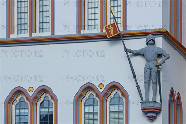 Knight with armour, lance, helmet and sword at the historic house Steipe built in 1430, figure, statue, Middle Ages, house wall, window, detail, main market, Trier, Rhineland-Palatinate, Germany, Europe