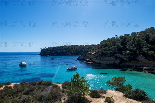 Private boats anchored in the bay in front of Playa El Mago, Cala de Portals Vells, Majorca, Balearic Islands, Spain, Europe