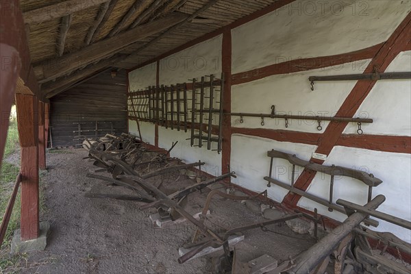 Ploughs and harrows under a meadow at the end of the 19th century, Schwerin-Muess Open-Air Museum of Folklore, Mecklenburg-Western Pomerania, Germany, Europe