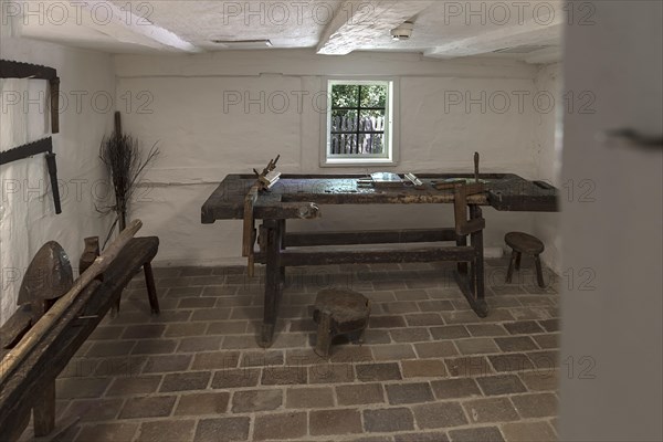 Workroom with workbench and tools in a historic farmhouse from the 19th century, Open-Air Museum of Folklore Schwerin-Muess, Mecklenburg-Western Pomerania, Germany, Europe