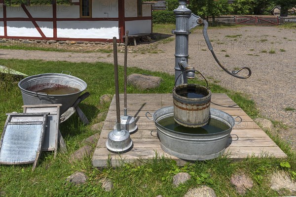 Laundry area with water pump in the garden from the 19th century, Open-Air Museum of Folklore Schwerin-Muess, Mecklenburg-Vorpommerm, Germany, Europe