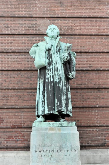 Bronze statue of Martin Luther in front of red brick wall, Hamburg, Hanseatic City of Hamburg, Germany, Europe