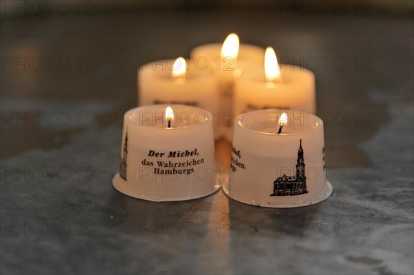 Michaeliskirche, Michel, baroque church St. Michaelis, first start of construction 1647- 1750, Burning white candles with lettering as decorative element and souvenir, Hamburg, Hanseatic City of Hamburg, Germany, Europe