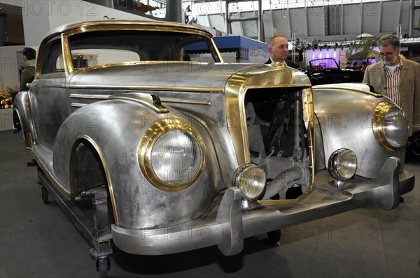 Mercedes-Benz classic car during restoration, RETRO CLASSICS 2010, Silver retro classic car with striking front view in an exhibition hall, Stuttgart Trade Fair Centre, Stuttgart, Baden-Wuerttemberg, Germany, Europe