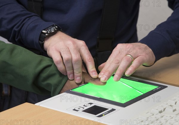 A refugee is registered and recorded by the Federal Police in Rosenheim, 05/02/2016