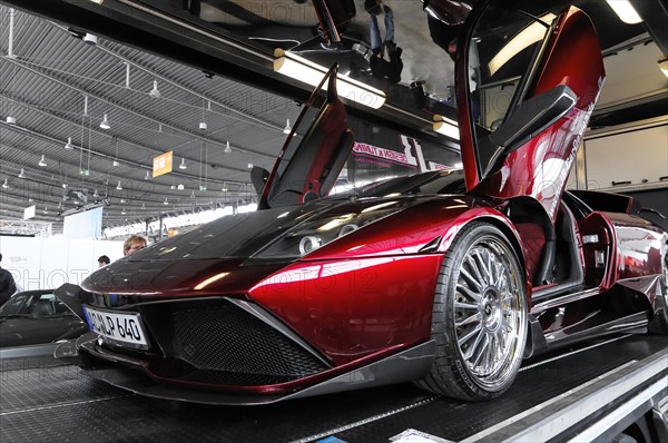 RETRO CLASSICS 2010, Stuttgart Messe, A red luxury sports car with open gullwing doors at a motor show, Stuttgart Messe, Stuttgart, Baden-Wuerttemberg, Germany, Europe