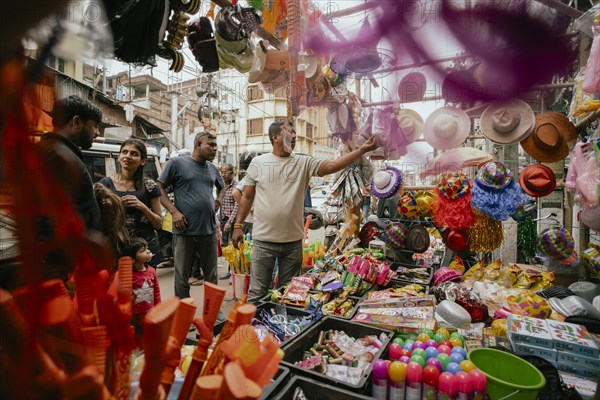 Vendor sells Holi celebration items in a street market, ahead of Holi festival on March 23, 2024 in Guwahati, Assam, India. Holi is the Hindu festival of colours, it is celebrated with great joy in India