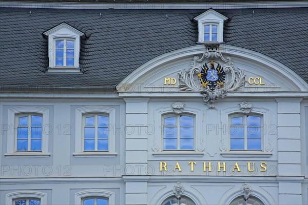 Old town hall built in 1750 with inscription, town hall, inscription, window, two, roman, number, year, coat of arms, eagle figure, heraldic bird, slate roof, Schlossplatz, Saarbruecken, Saarland, Germany, Europe