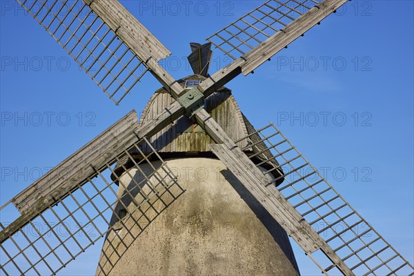 Wings of the windmill Auf der Hoechte under a cloudless blue sky in Hille, Muehlenkreis Minden-Luebbecke, North Rhine-Westphalia, Germany, Europe
