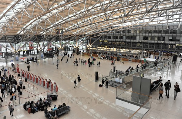 Spacious view of an airport terminal with travellers and a modern roof construction, Hamburg, Hanseatic City of Hamburg, Germany, Europe