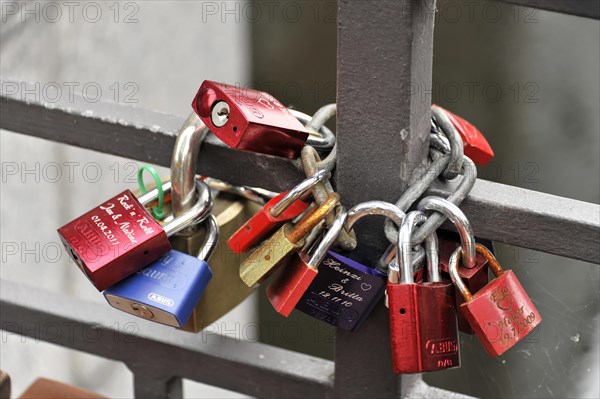 Love locks of young lovers at the Niederbaumbruecke, Speicherstadt, Hamburg harbour, Different coloured love locks on bars of a fence, Hamburg, Hanseatic City of Hamburg, Germany, Europe