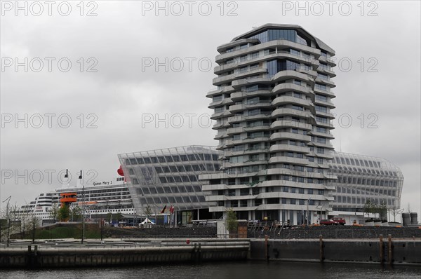 Marco Polo Tower, cruise ship behind a modern building facade on a cloudy day, Hamburg, Hanseatic City of Hamburg, Germany, Europe