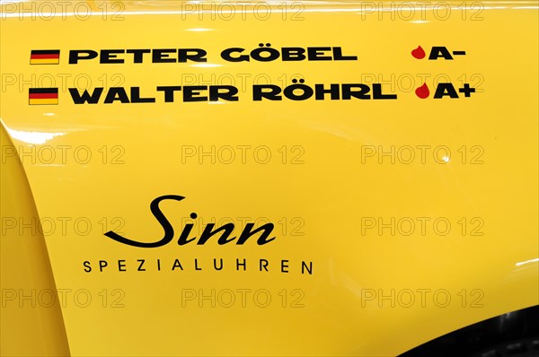 RETRO CLASSICS 2010, Stuttgart Messe, A yellow car with the names Peter Goebel and Walter Roehrl and the logo of Sinn Spezialuhren, Stuttgart Messe, Stuttgart, Baden-Wuerttemberg, Germany, Europe