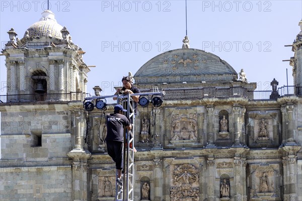 Oaxaca, Mexico, Workers set up lighting for youth boxing matches in front of the Metropolitan Cathedral of Oaxaca, Central America