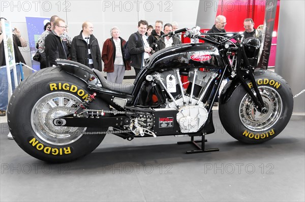 RETRO CLASSICS 2010, Stuttgart Trade Fair, Black exhibition motorbike with eye-catching RIGDON tyres, surrounded by trade fair visitors, Stuttgart Trade Fair, Stuttgart, Baden-Wuerttemberg, Germany, Europe