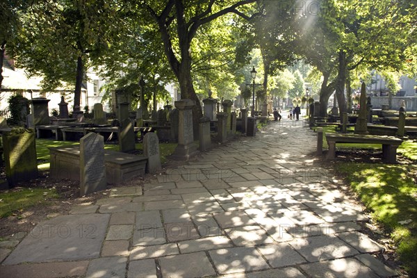 Lens flare, Graves in churchyard, Saint Nicholas Kirk, Aberdeen, Scotland, United Kingdom, Europe