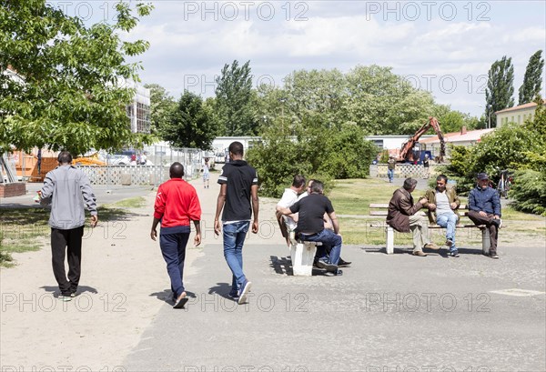 Refugees at the central contact point for asylum seekers in Brandenburg, Eisenhuettenstadt, 3 June 2015