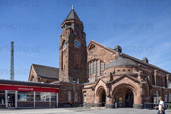 Historic Wilhelmine railway station, clock tower, pavilion with entrance to the station building, neo-Romanesque and Art Nouveau, red sandstone, cultural monument, listed building, Giessen, Giessen, Hesse, Germany, Europe