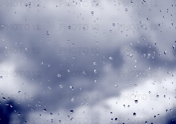 Raindrops on a window pane, North Rhine-Westphalia, Germany, Europe