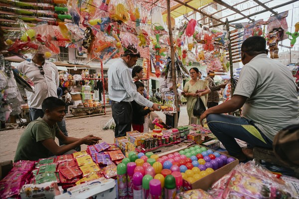 Vendor sells Holi celebration items in a street market, ahead of Holi festival on March 23, 2024 in Guwahati, Assam, India. Holi is the Hindu festival of colours, it is celebrated with great joy in India