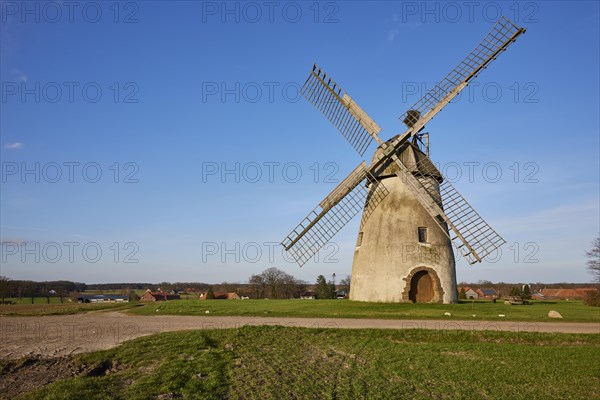 Windmill Auf der Hoechte under a cloudless blue sky is part of the Westphalian Mill Road in Hille, Muehlenkreis Minden-Luebbecke, North Rhine-Westphalia, Germany, Europe