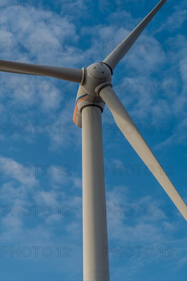 Low angle view of electrical generating windmill against cloudy sky in Buan, South Korea, Asia